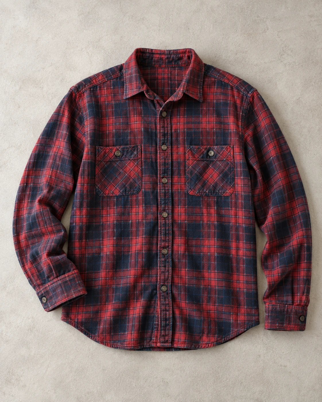 Softly faded red and navy plaid flannel concept